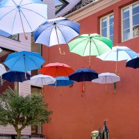 Flying umbrellas over outdoor restaurant in Bergen, Norway